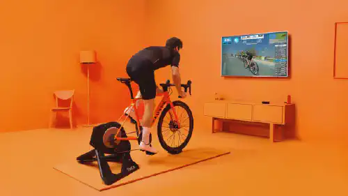 Man indoor cycling on zwift (not me)